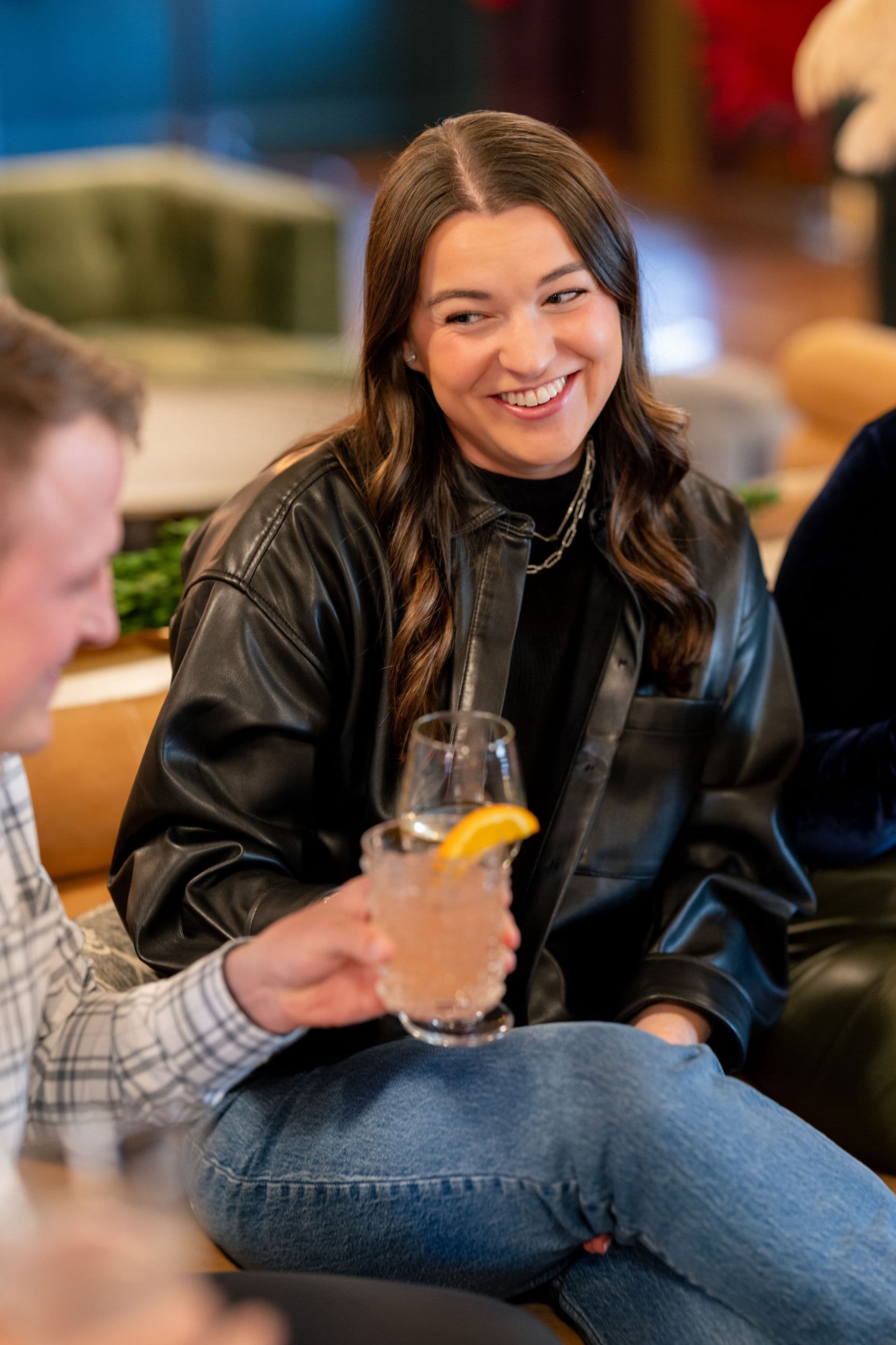 Guest smiling with cocktail